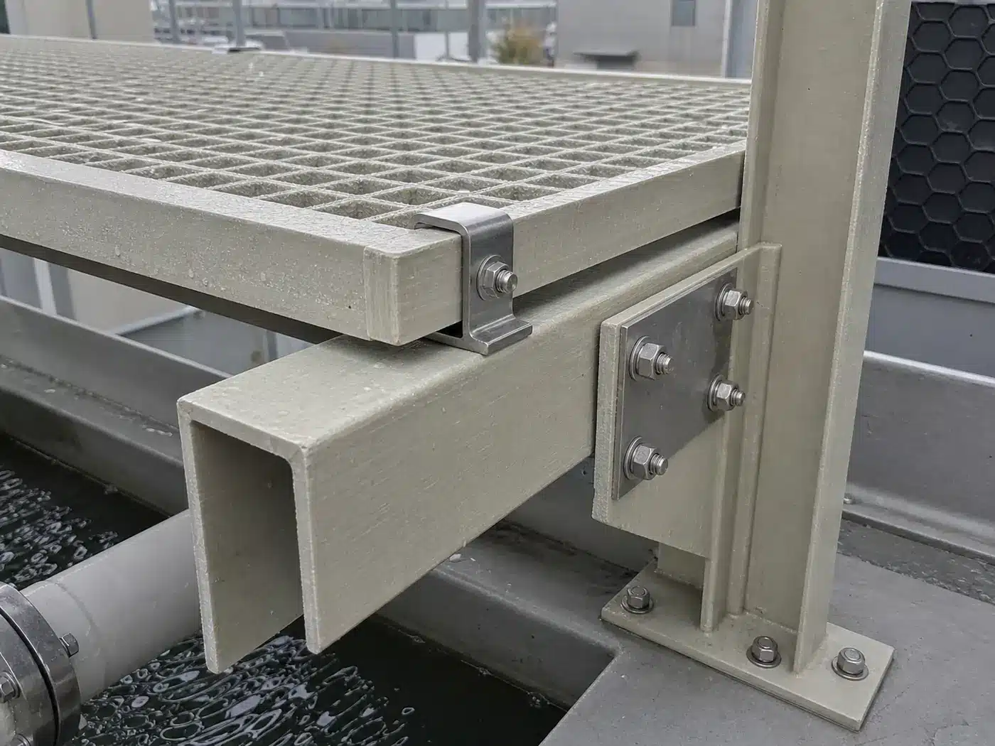 Representative FRP grating, channel and column connection with stainless hardware in a wet cooling environment
