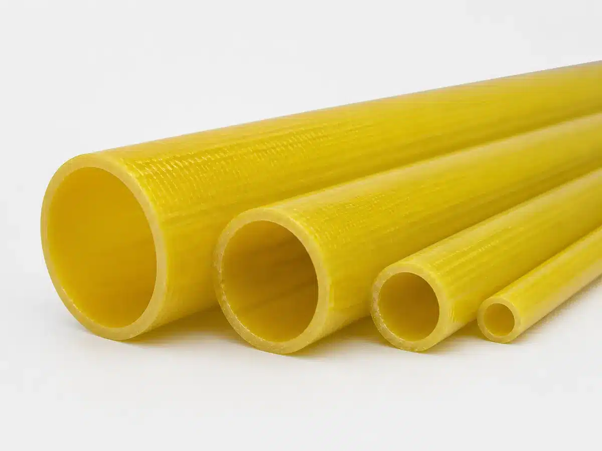 Illustrative yellow pultruded fiberglass round tubes in different diameters